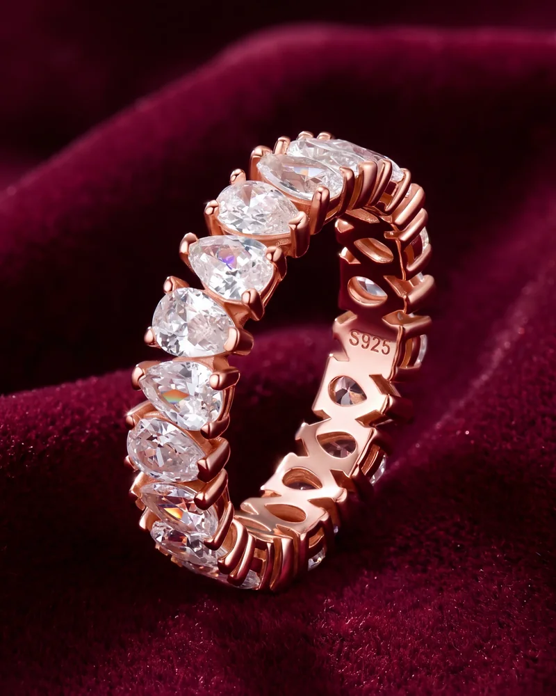 Pear-cut moissanite eternity band in 18K rose gold plated sterling silver